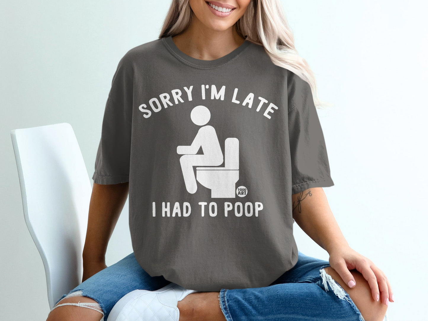 Dark grey t-shirt with white text and graphic: "Sorry I'm late, I had to poop."