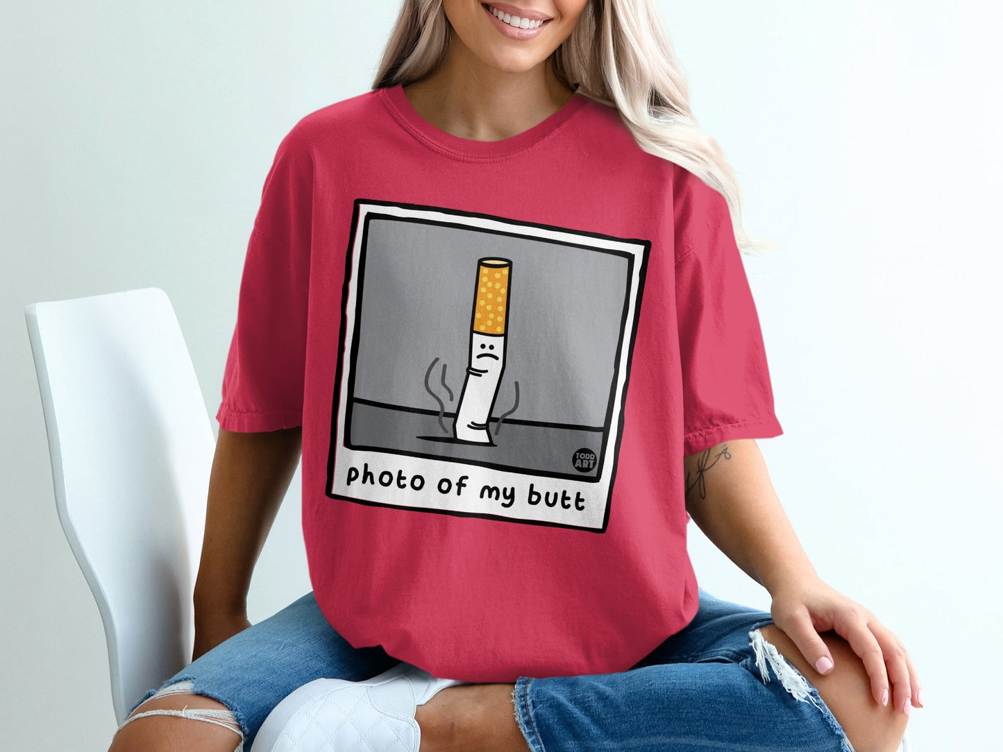 T-shirt with cartoon cigarette that says "photo of my butt".