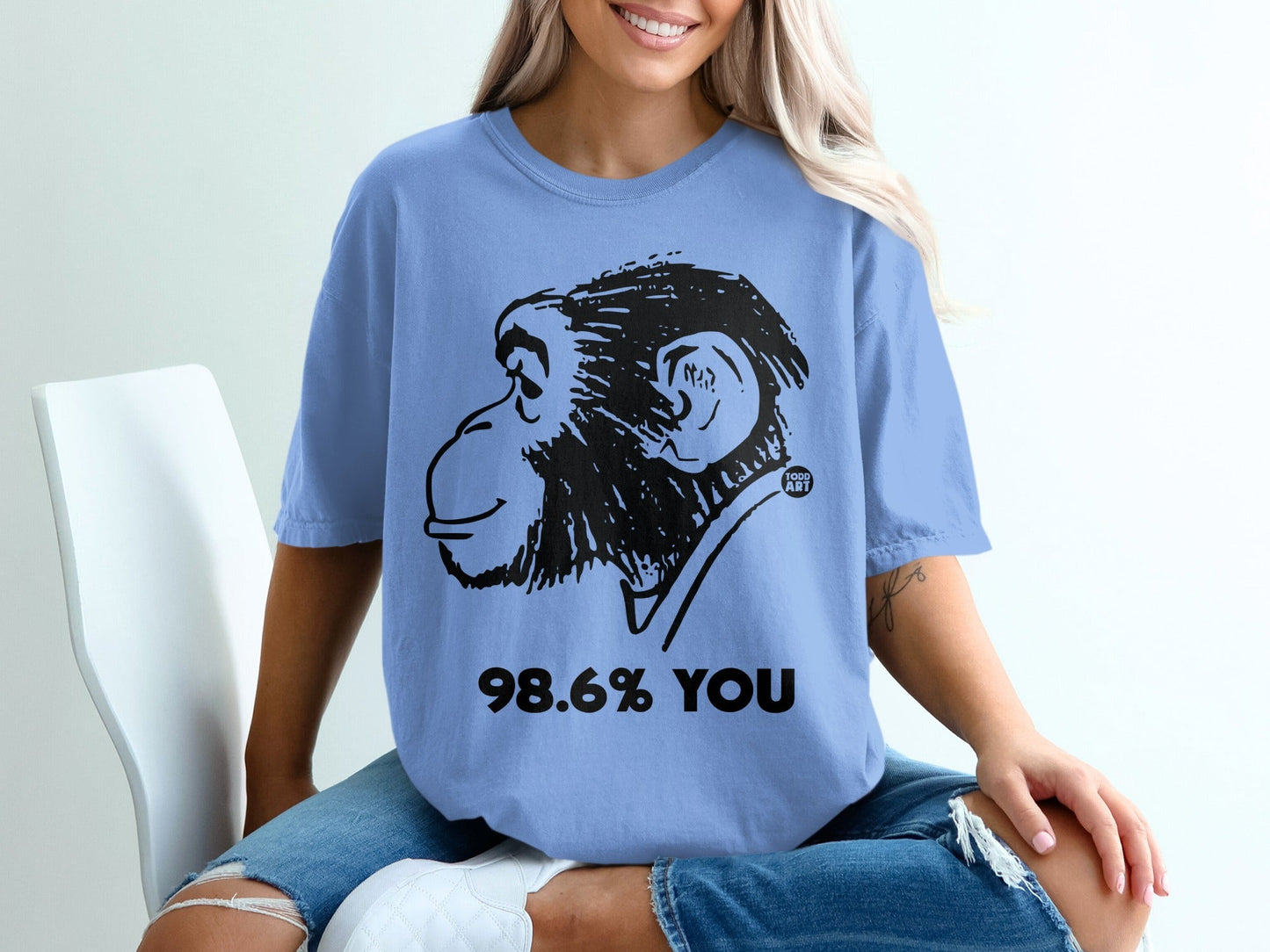 Periwinkle t-shirt with black monkey graphic and text "98.6% YOU".