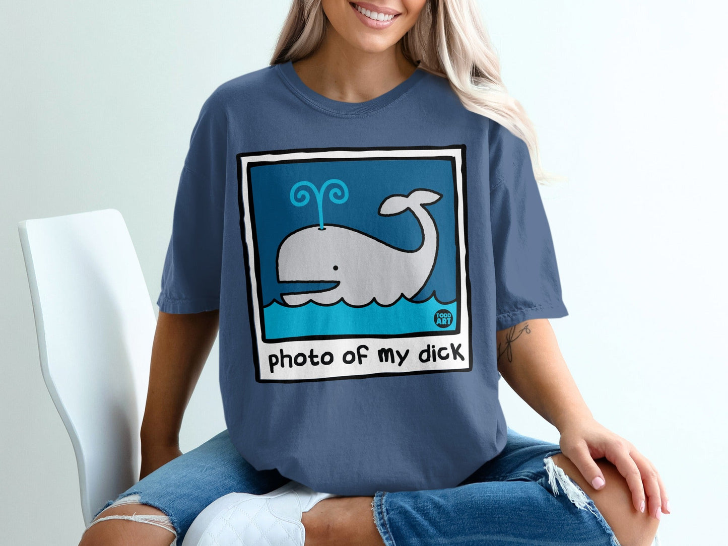 Blue t-shirt with a cartoon whale and "photo of my dick" text.