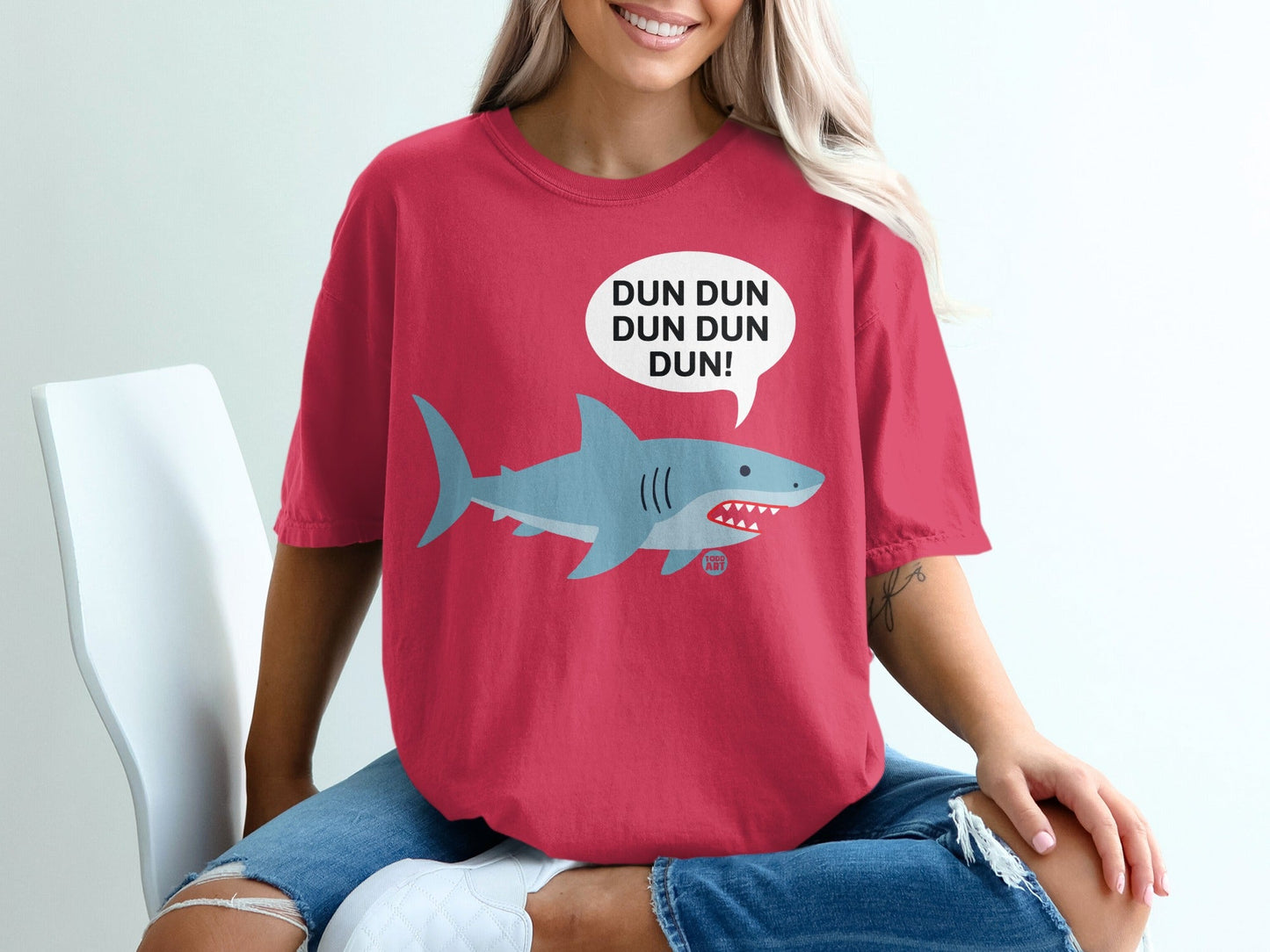 Red t-shirt with a cartoon shark and "DUN DUN DUN DUN!" speech bubble.