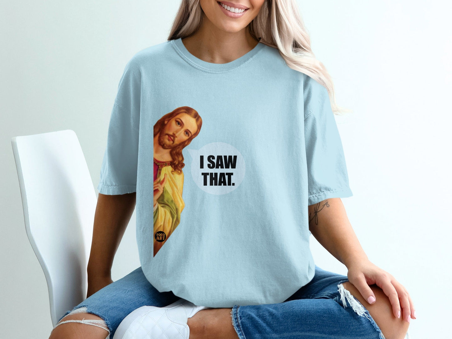 Light blue t-shirt with Jesus saying "I SAW THAT."