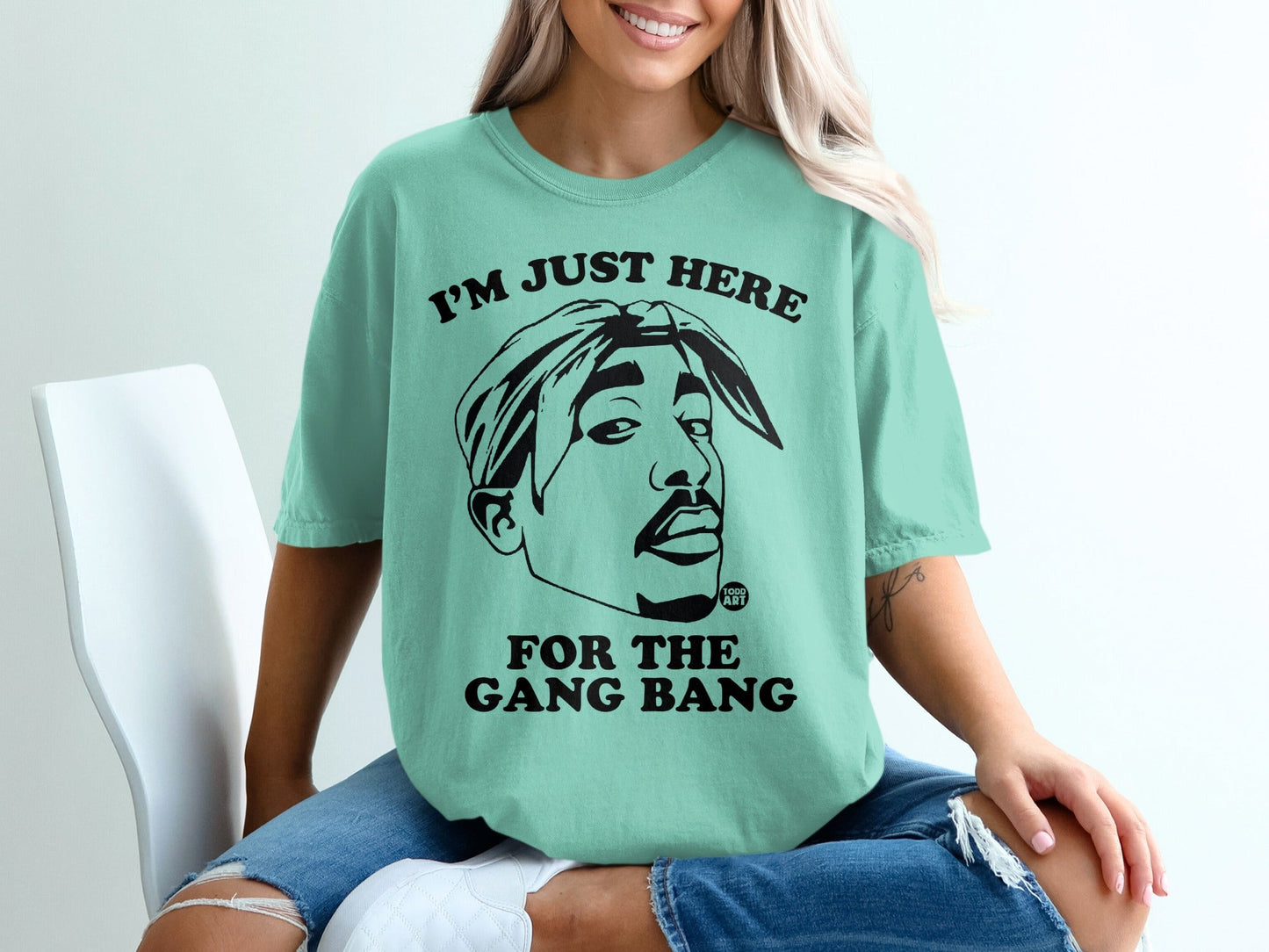 Teal t-shirt with Tupac Shakur graphic and text "I'M JUST HERE FOR THE GANG BANG".