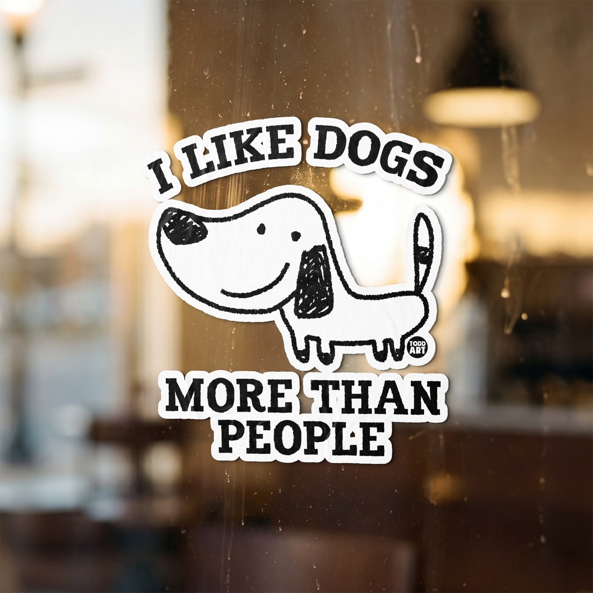 Sticker with a cartoon dog and text "I LIKE DOGS MORE THAN PEOPLE."