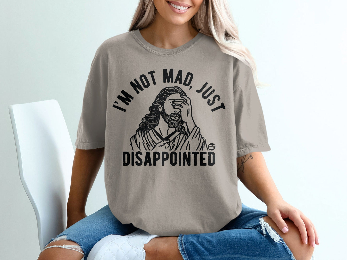 T-shirt with graphic of Jesus saying "I'M NOT MAD, JUST DISAPPOINTED."