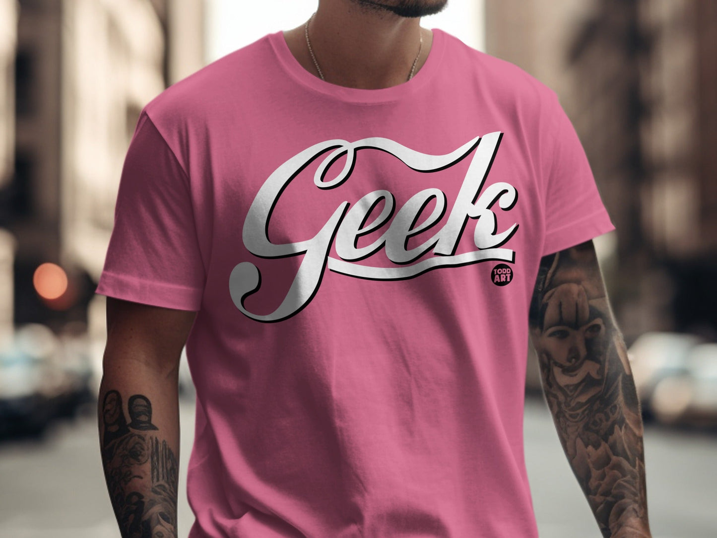 Pink t-shirt with "Geek" and "Food Art" text, on a man.