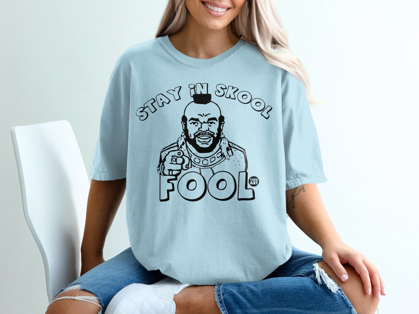Light blue t-shirt with "STAY IN SKOOL FOOL" graphic featuring Mr. T.