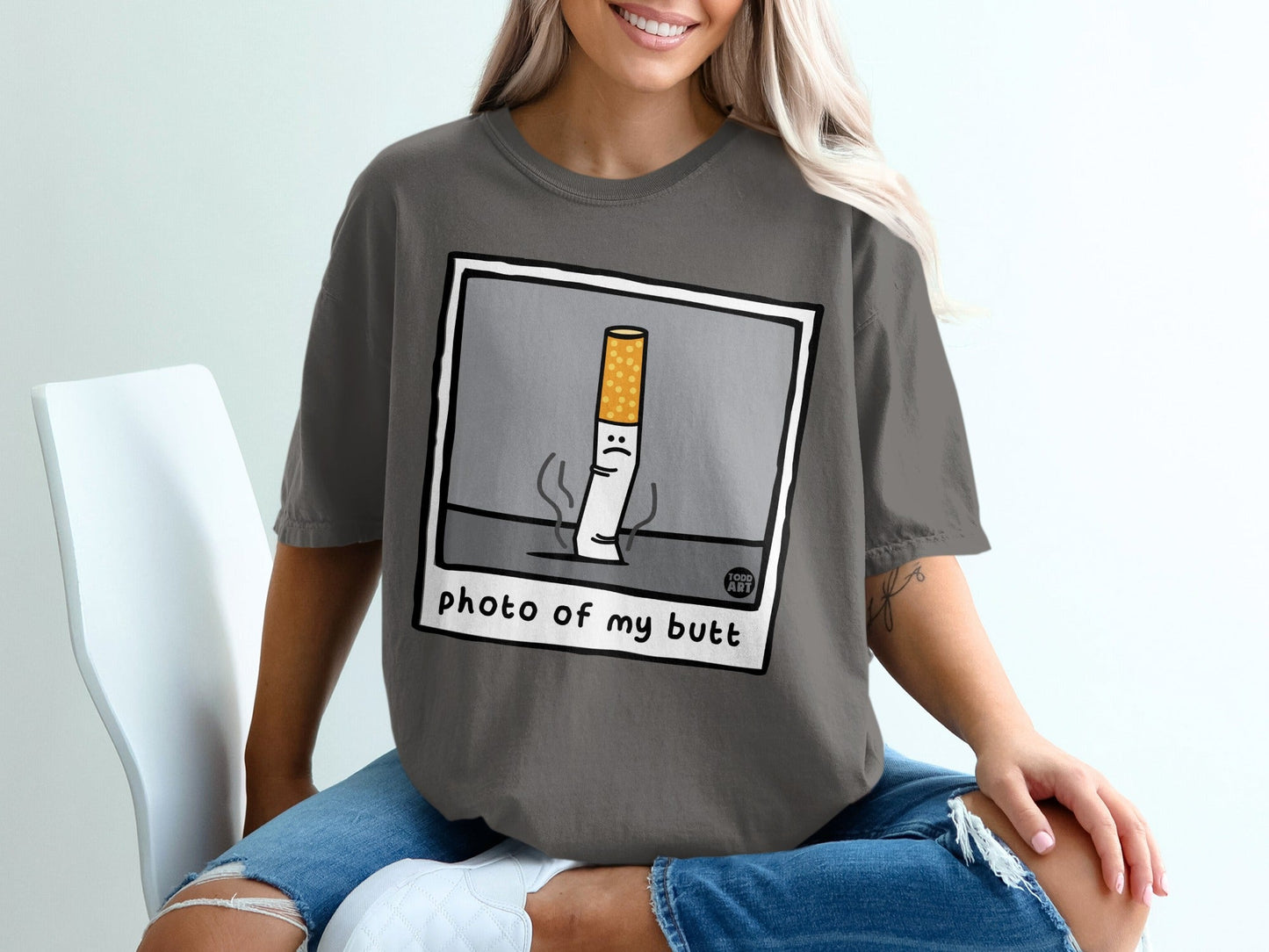 T-shirt with cartoon cigarette saying "photo of my butt".