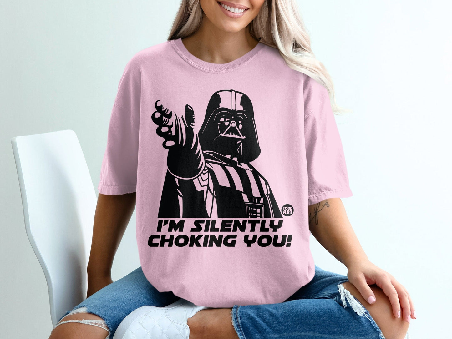 Pink t-shirt with Darth Vader pointing and text "I'm silently choking you!".