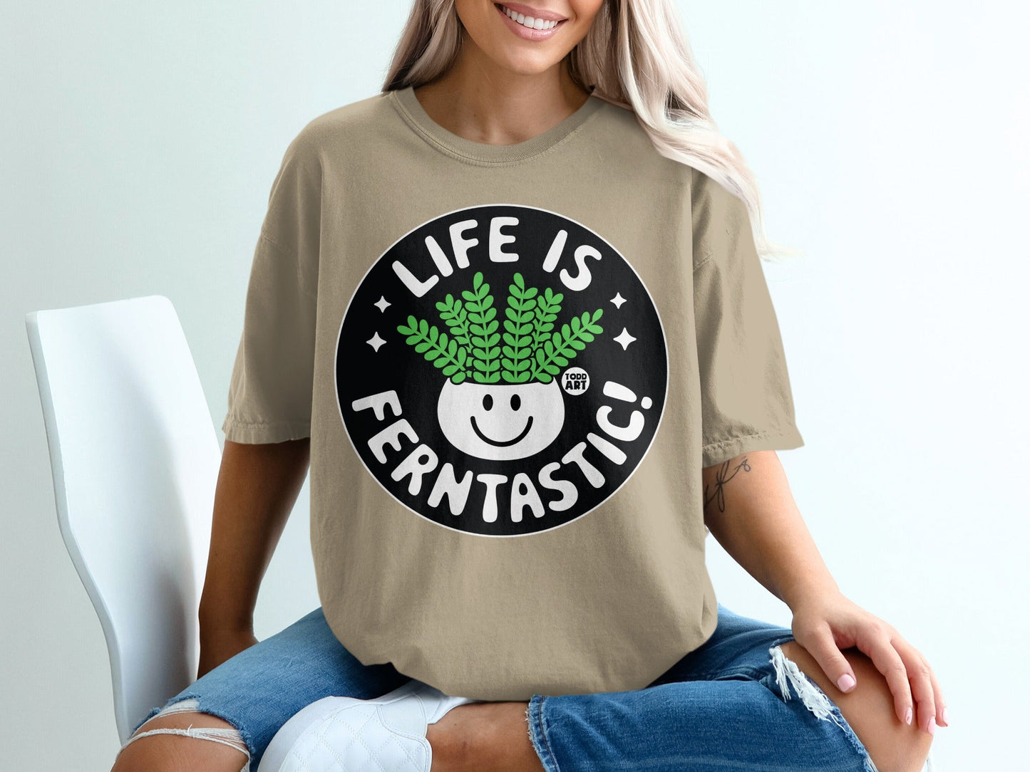 T-shirt with "Life is Ferntastic!" text and smiling potted plant graphic.