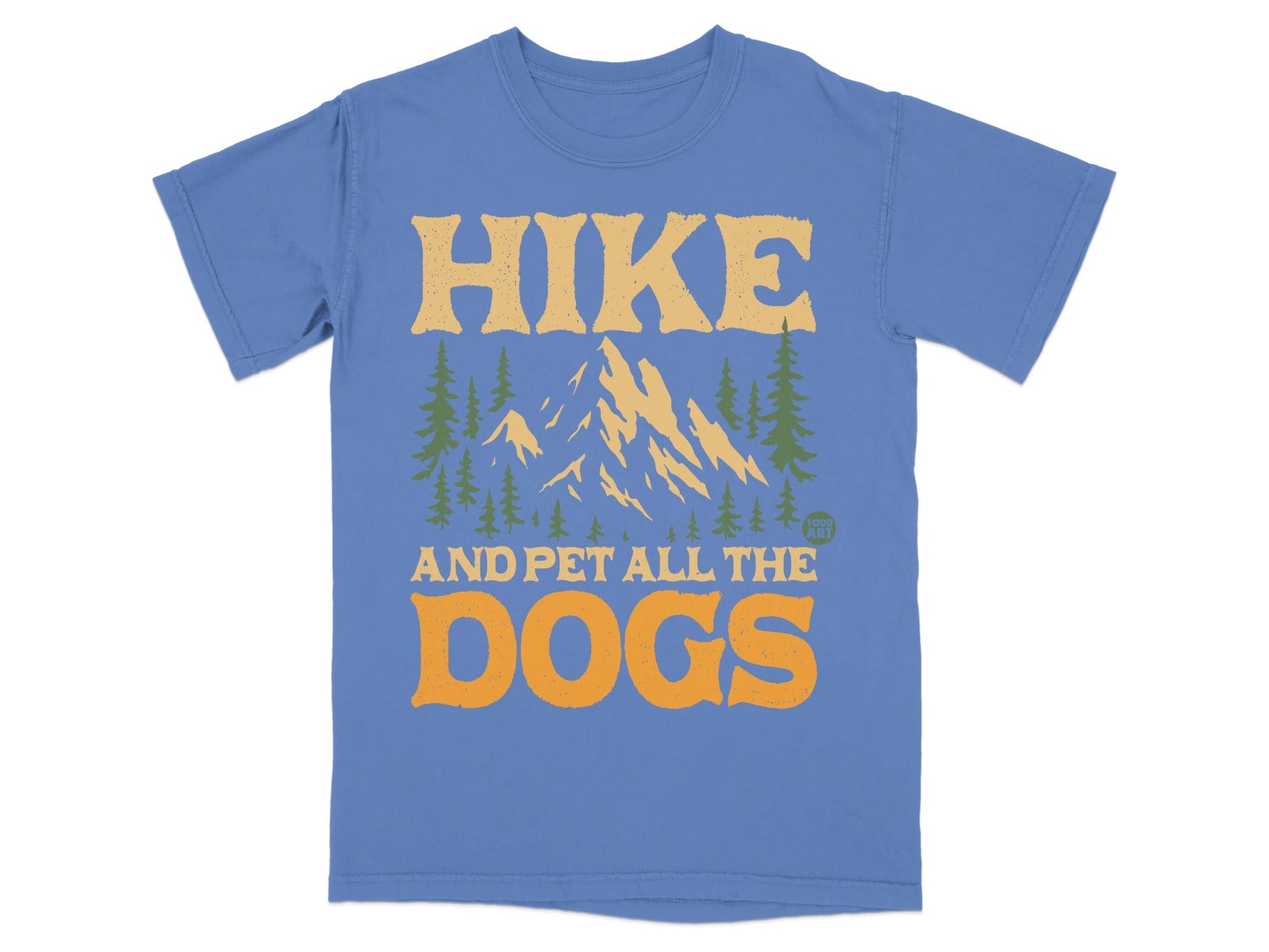 Blue t-shirt with mountains, trees, and text "HIKE AND PET ALL THE DOGS".