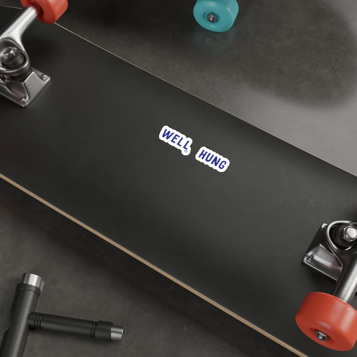 Well Hung Text Skateboard Deck with Colorful Wheels
