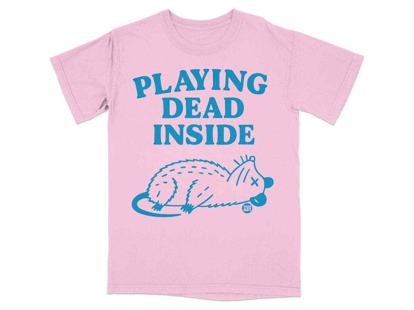 Pink t-shirt with blue text "PLAYING DEAD INSIDE" and a dead opossum illustration.