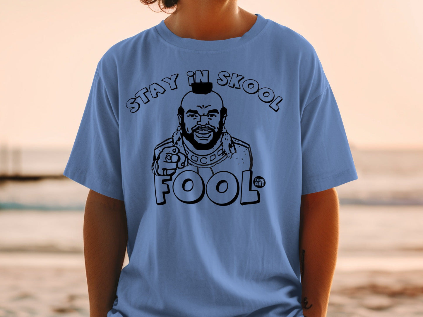 Blue t-shirt with Mr. T graphic and "STAY IN SKOOL FOOL" text.