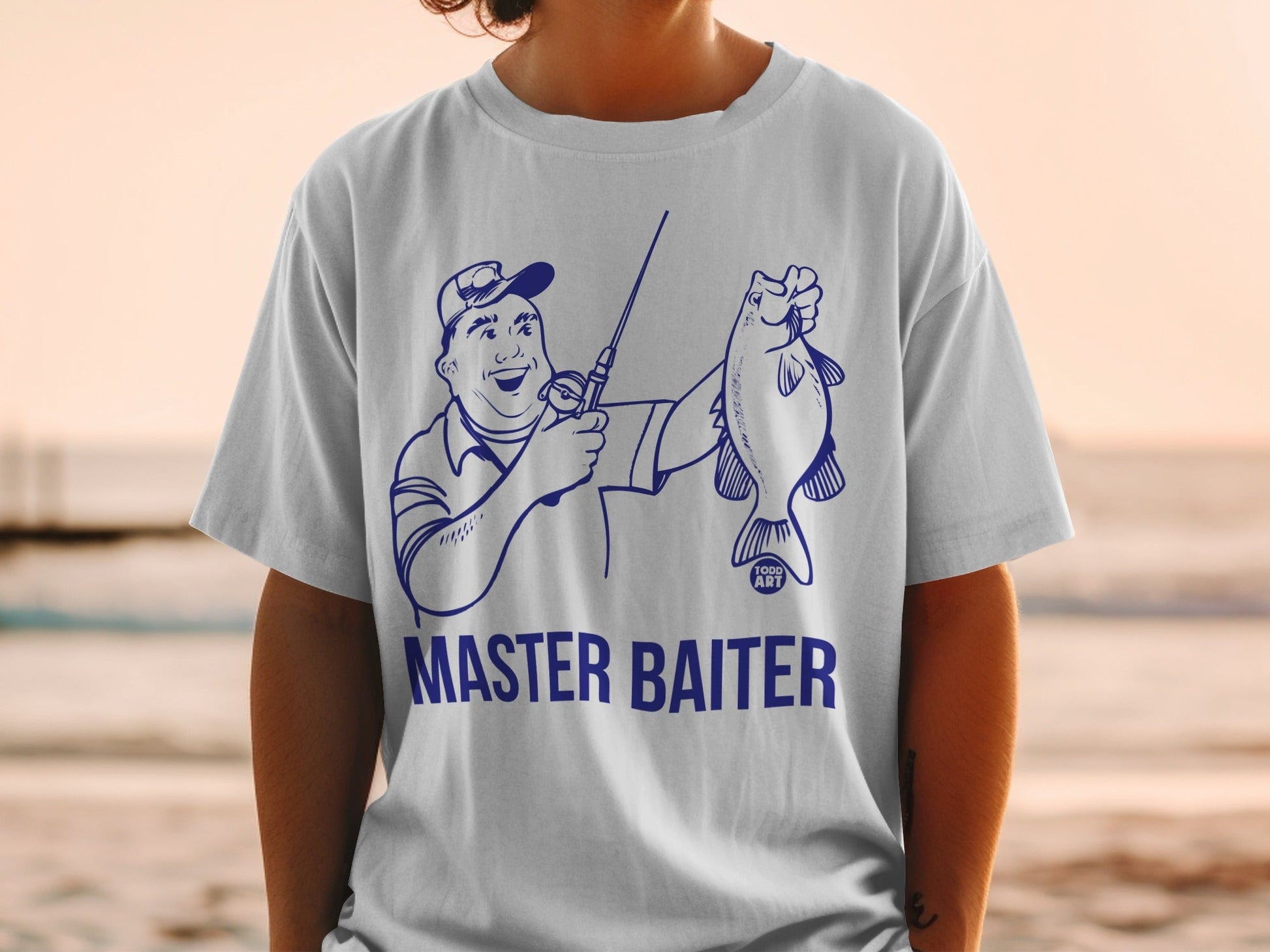 T-shirt with illustration of angler holding fish, text "MASTER BAITER".