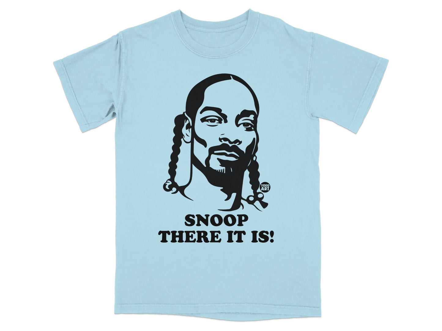 Light blue t-shirt with black graphic of Snoop Dogg's face and text "SNOOP THERE IT IS!".