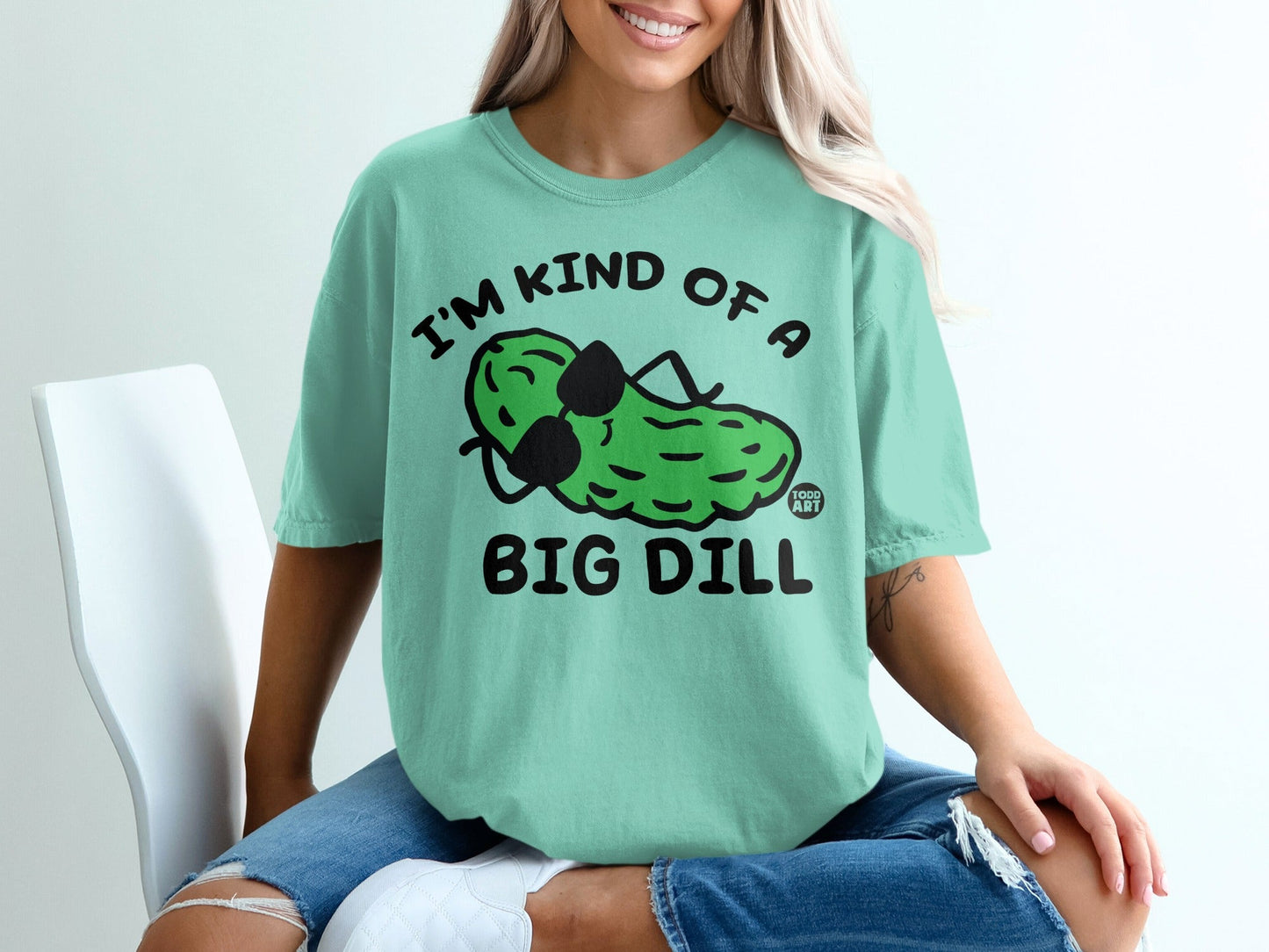 Green t-shirt with "I'm kind of a big dill" pickle graphic.
