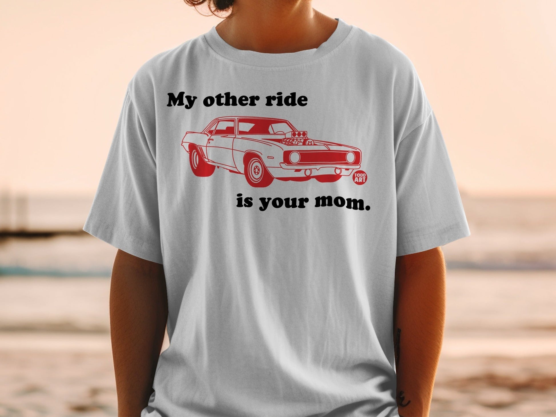 Grey t-shirt with red graphic of a vintage muscle car and text "My other ride is your mom."