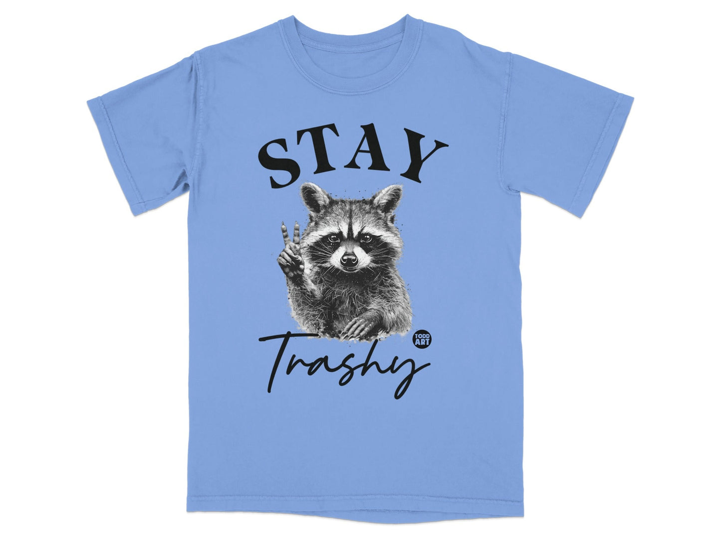 Light blue t-shirt with a raccoon holding up peace sign and text "STAY Trashy".