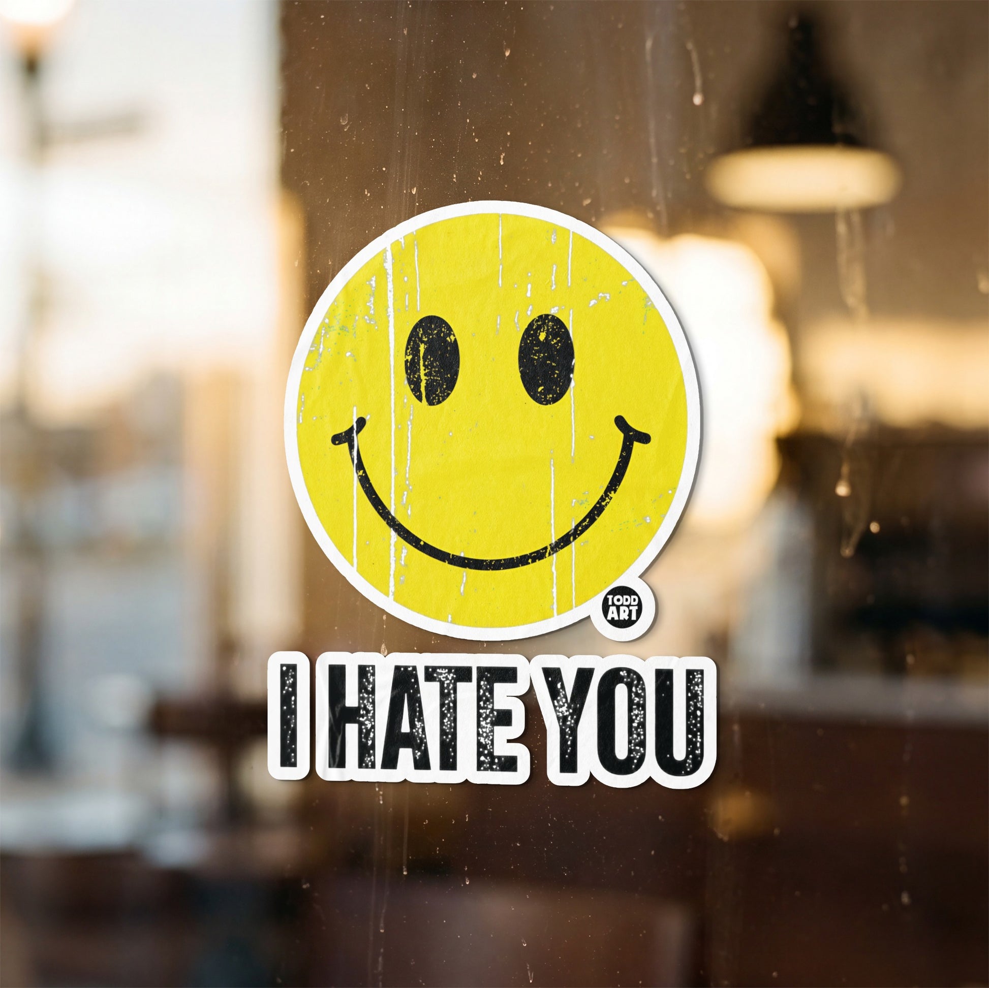 Distressed yellow smiley face sticker with "I HATE YOU" text below.