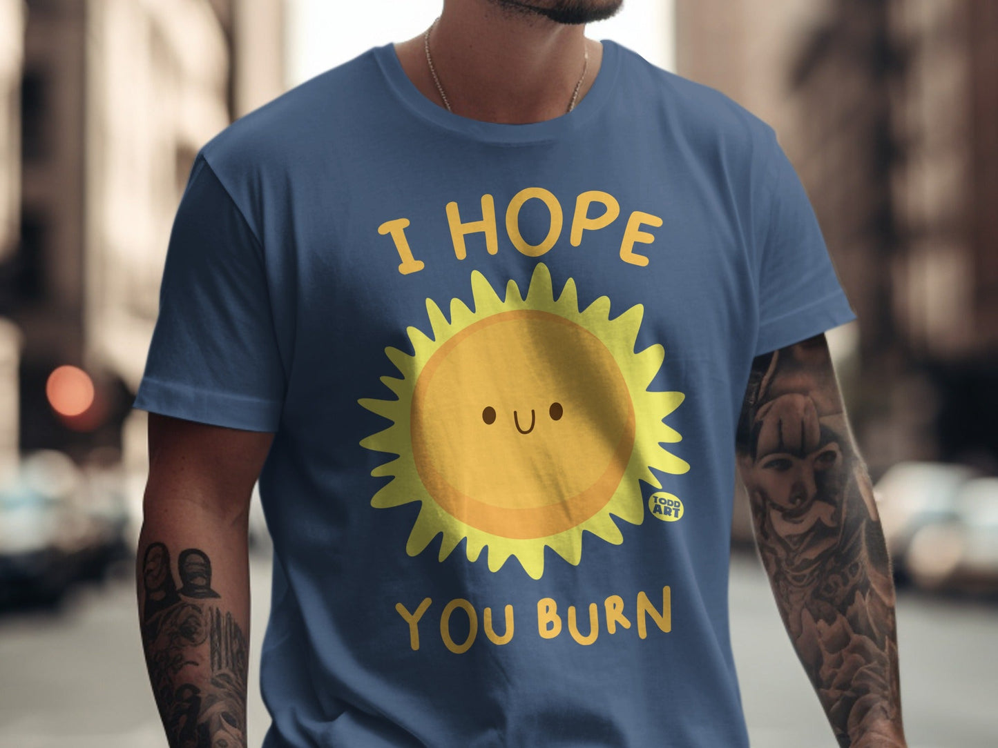 Navy t-shirt with a smiling sun graphic and text "I HOPE YOU BURN".