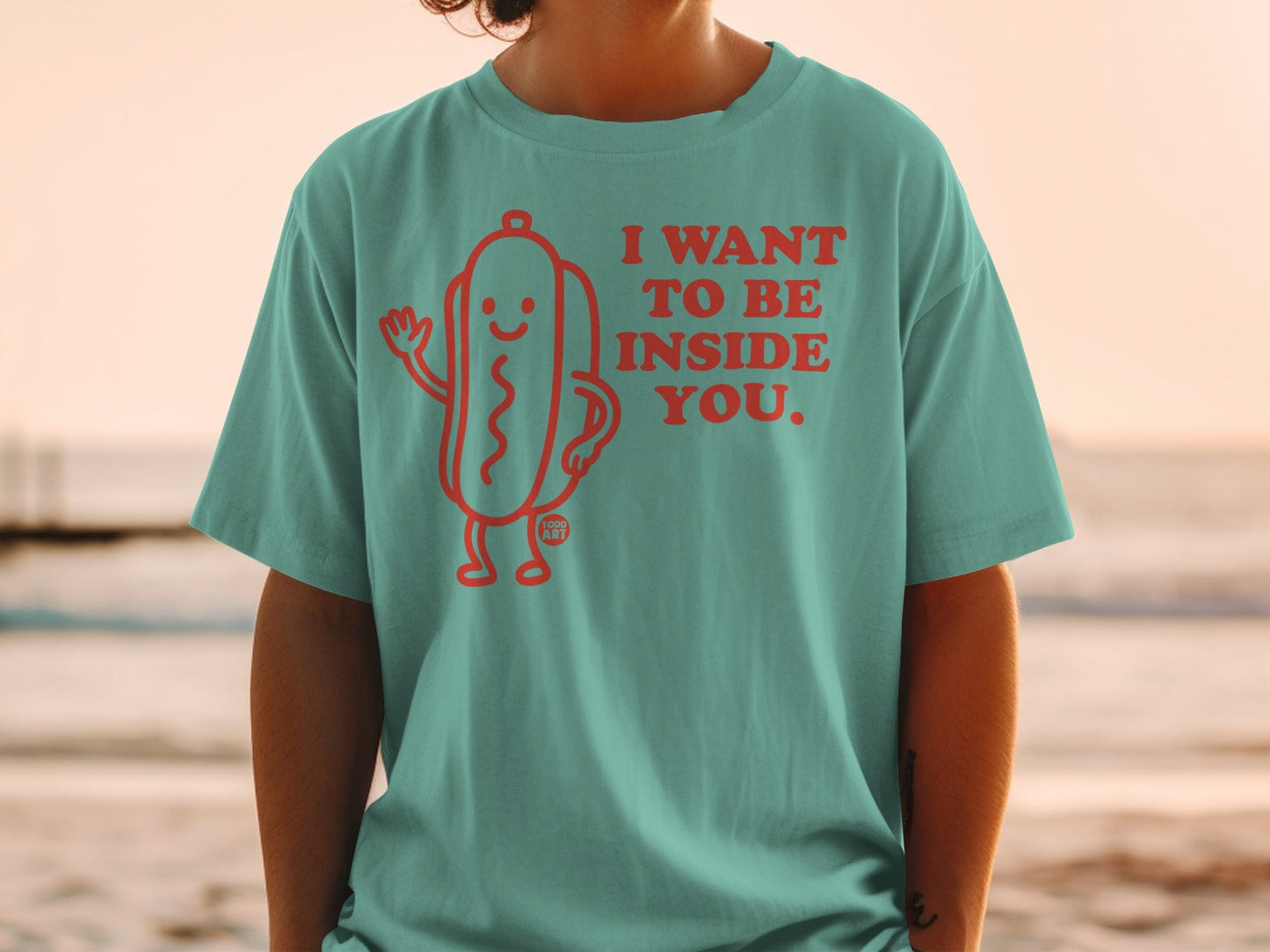 T-shirt with cartoon hot dog saying "I want to be inside you."