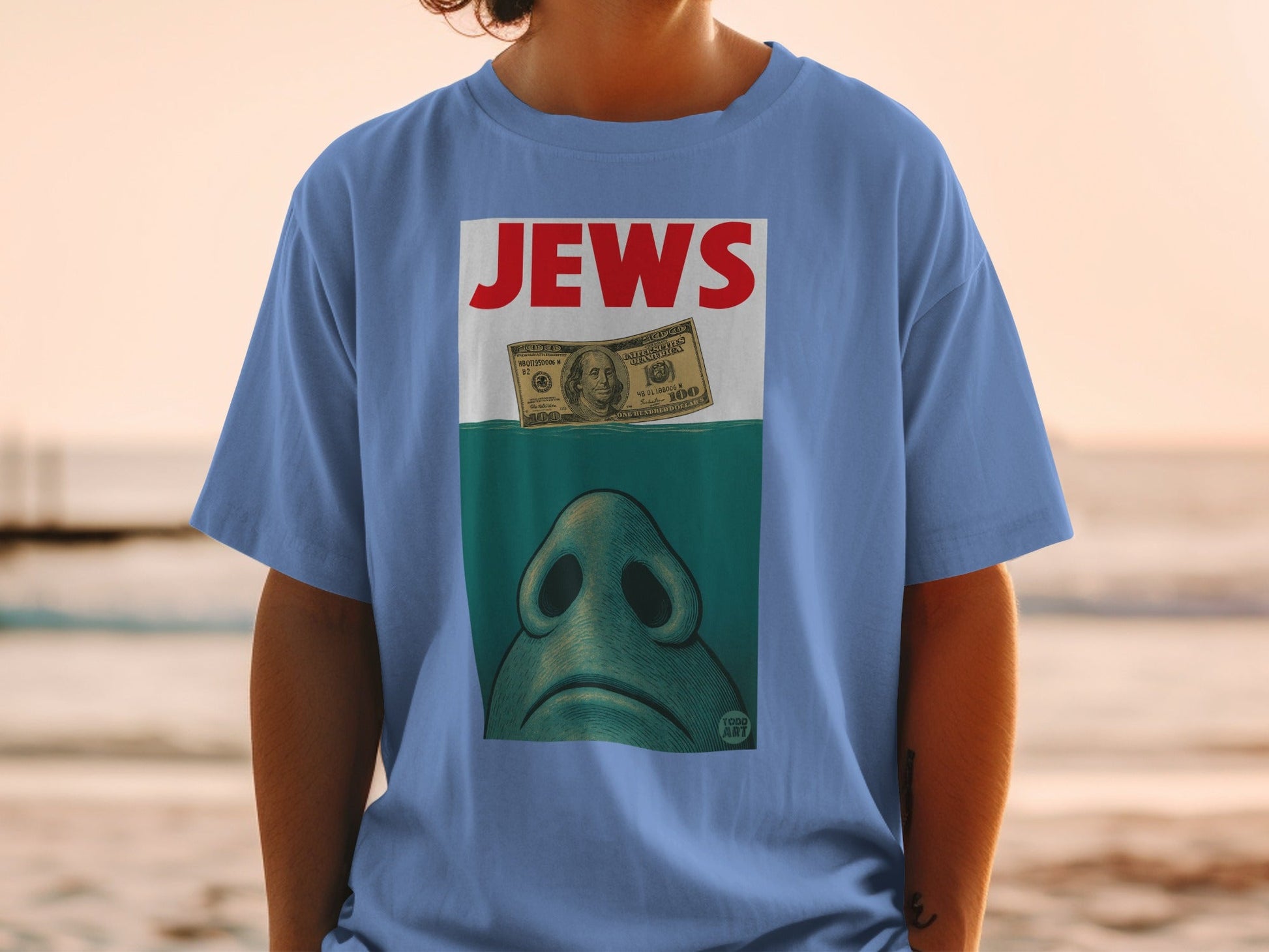 T-shirt with "JEWS" text, a shark nose, and a $100 bill.