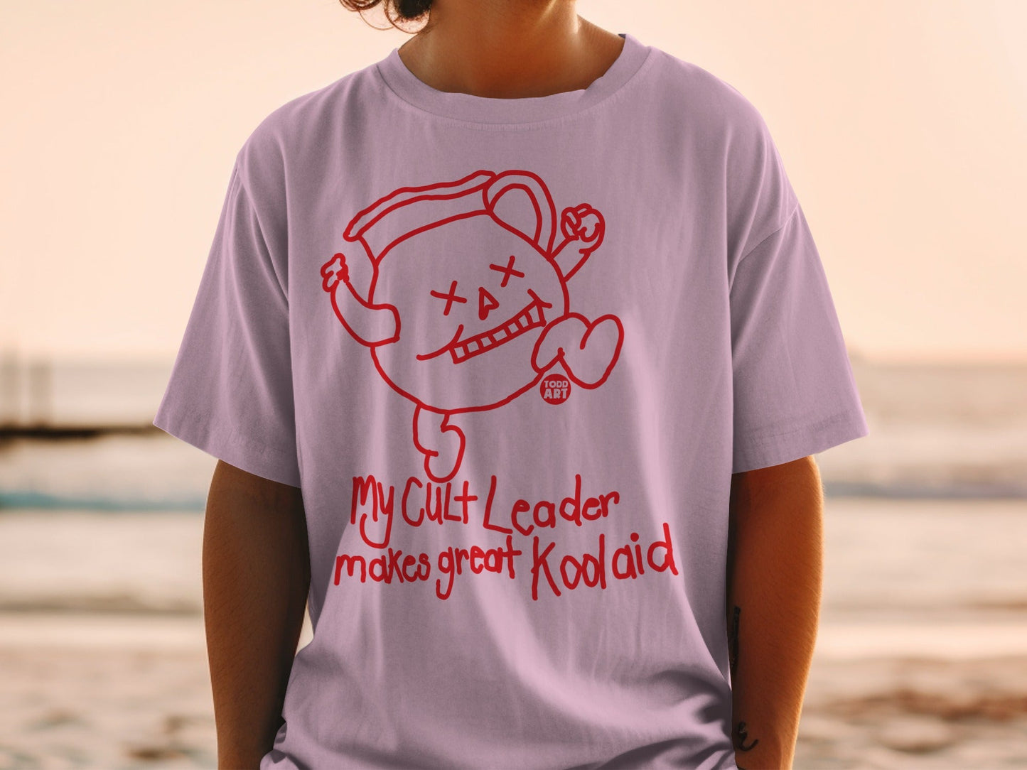 T-shirt with "My Cult Leader makes great Kool-Aid" text and Kool-Aid character graphic.