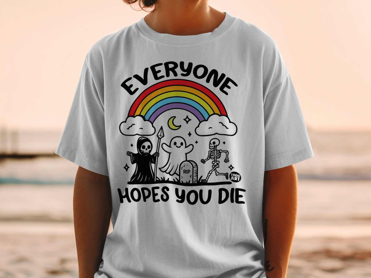 T-shirt with skeleton, ghost, grim reaper, rainbow, and text "Everyone Hopes You Die".