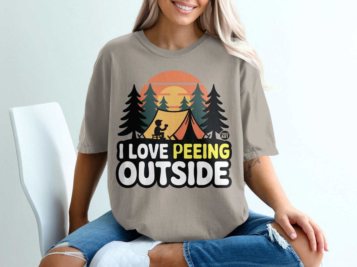 T-shirt with "I Love Peeing Outside" text and camping graphic.