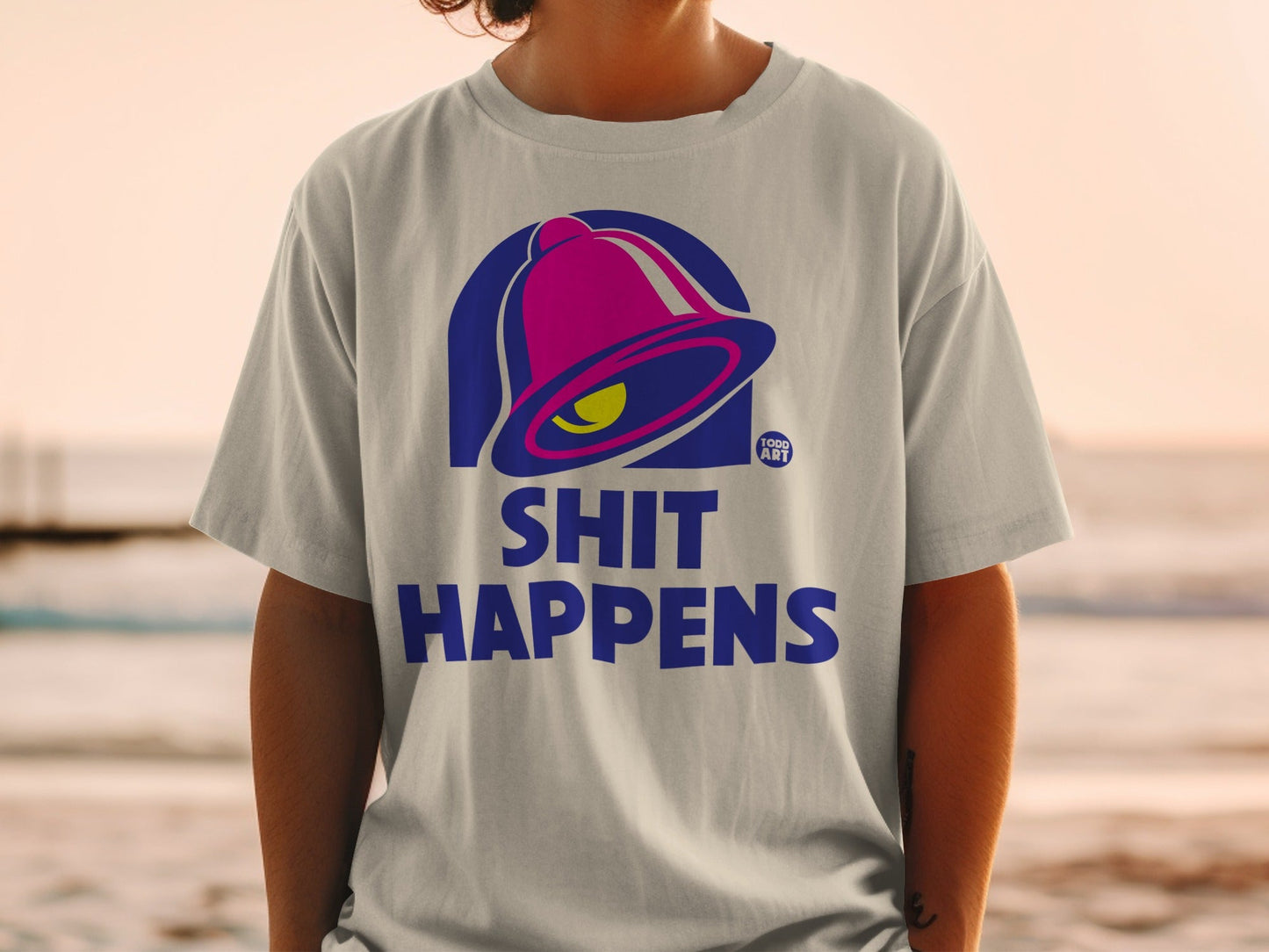 Gray t-shirt with Taco Bell logo and "SHIT HAPPENS" text.