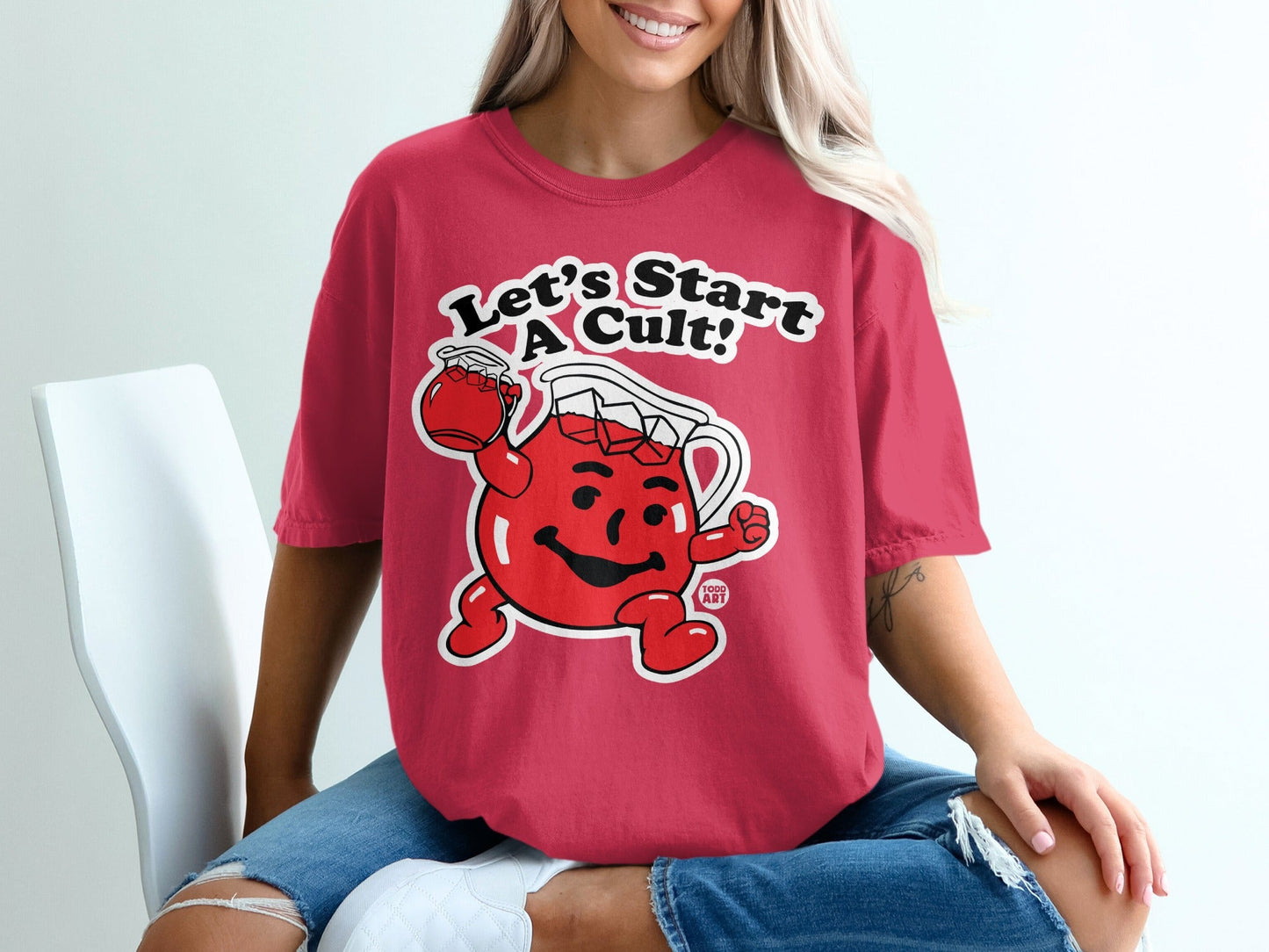 Red t-shirt with Kool-Aid Man graphic saying "Let's Start a Cult!".