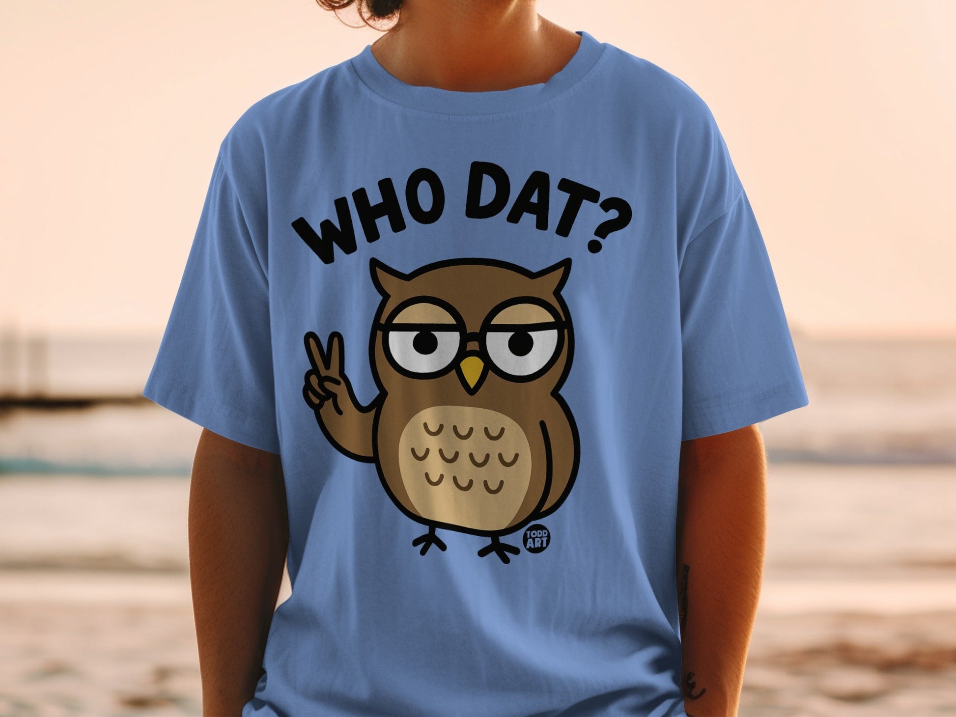 Blue t-shirt with a cartoon owl wearing glasses and the text "WHO DAT?".