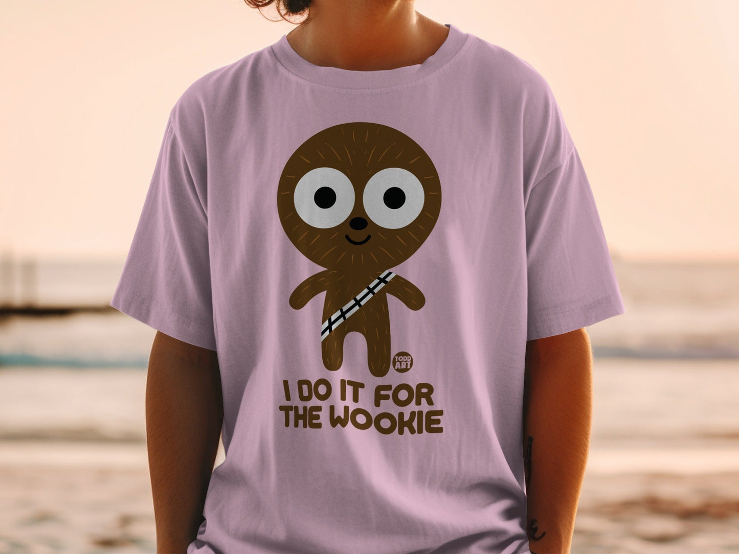 Cartoon Wookiee graphic on a purple t-shirt saying "I DO IT FOR THE WOOKIE".