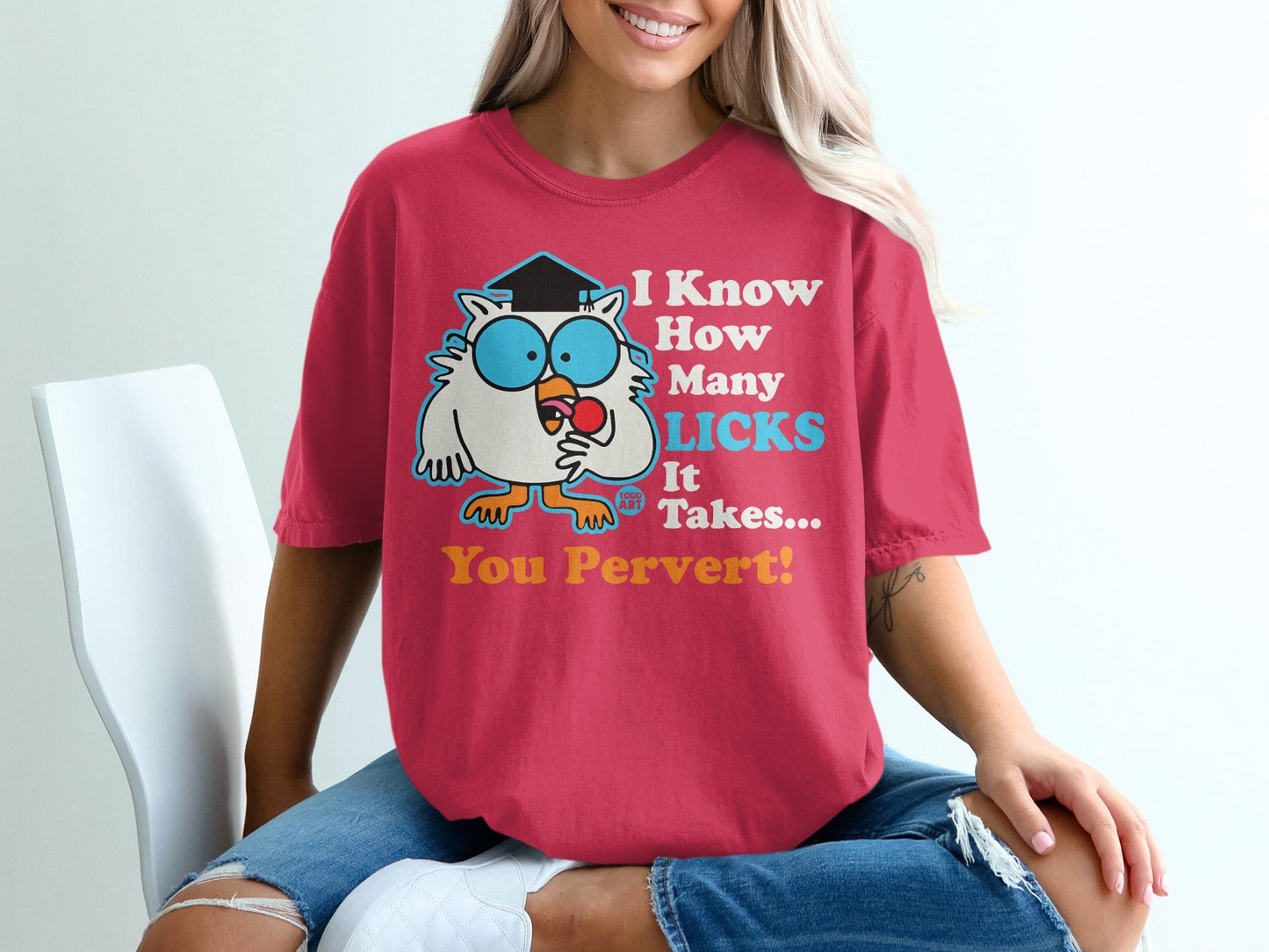 Pink t-shirt with cartoon owl in graduation cap, holding lollipop, saying "I Know How Many Licks It Takes... You Pervert!"