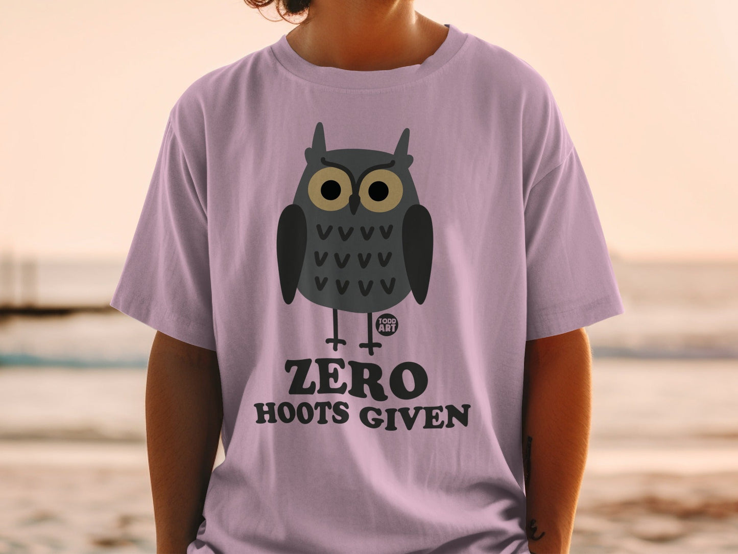 Purple t-shirt with a cartoon owl graphic and "ZERO HOOTS GIVEN" text.