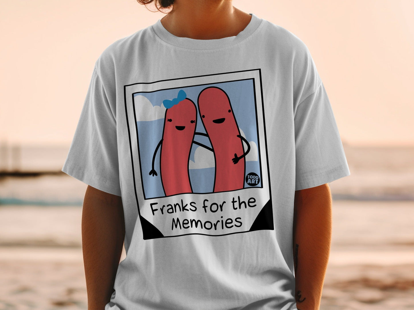 T-shirt featuring a cartoon hot dog couple with "Franks for the Memories" text.