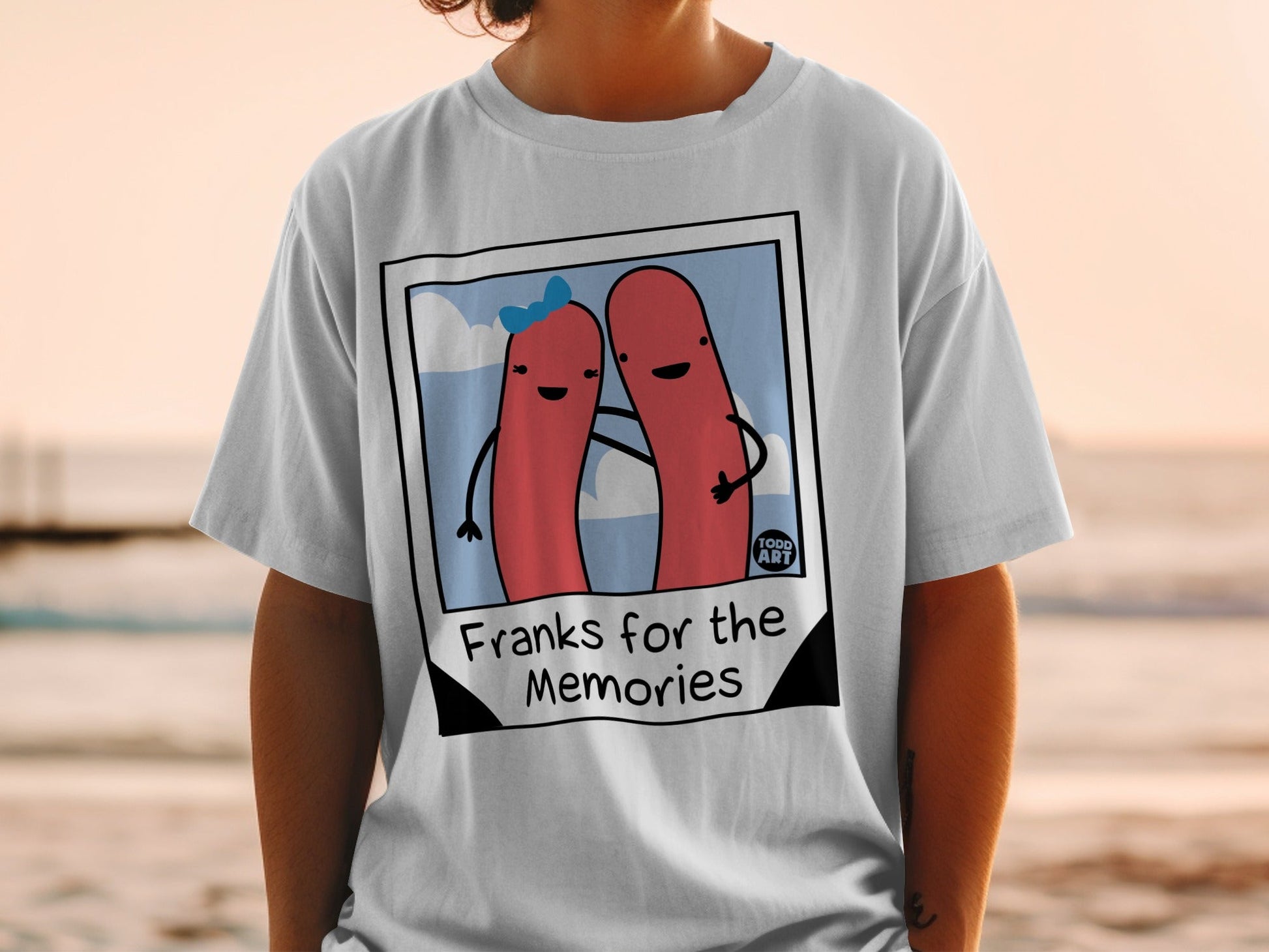 T-shirt featuring a cartoon hot dog couple with "Franks for the Memories" text.
