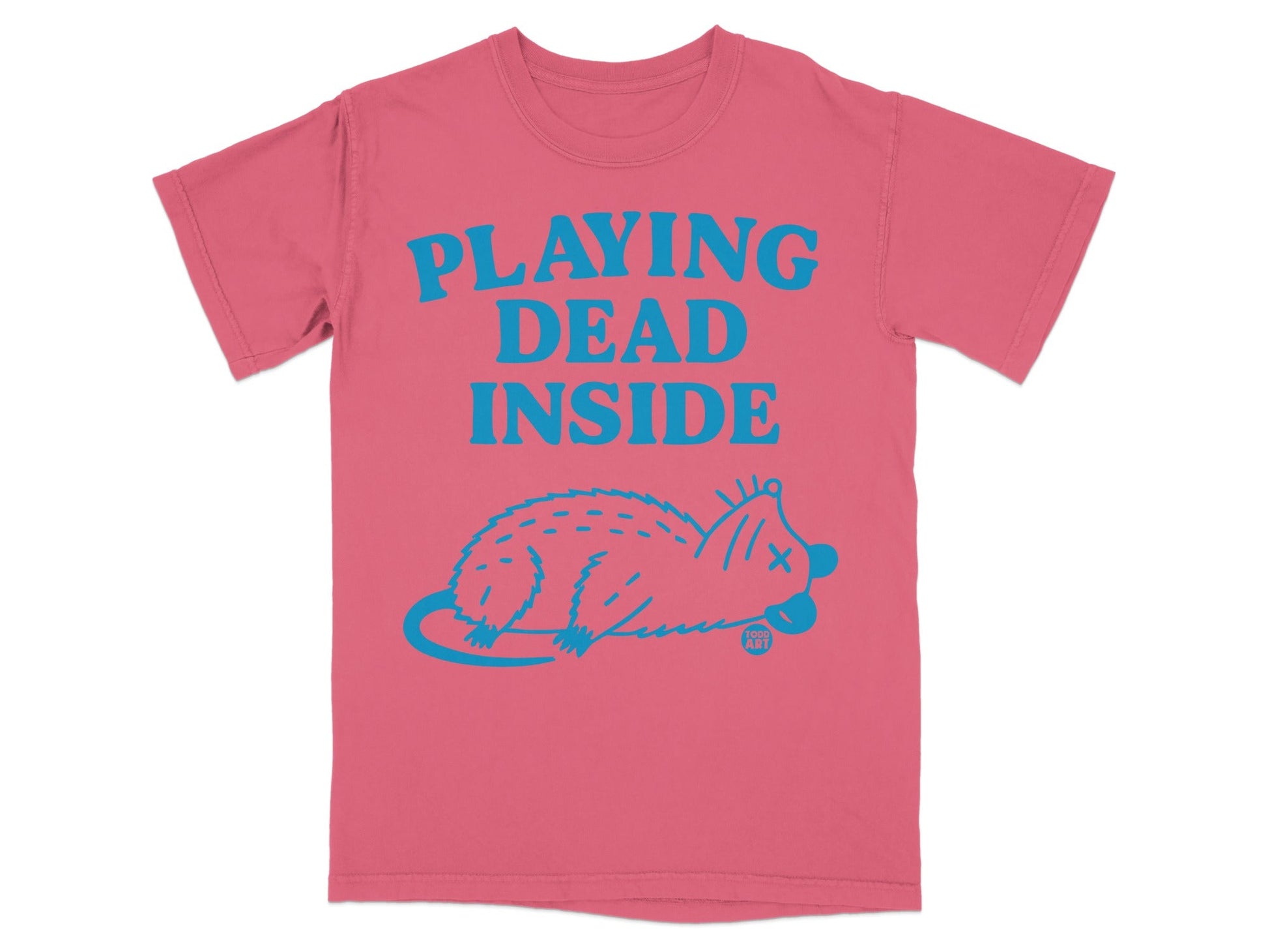 Pink t-shirt with bright blue text "PLAYING DEAD INSIDE" and cartoon rat graphic.