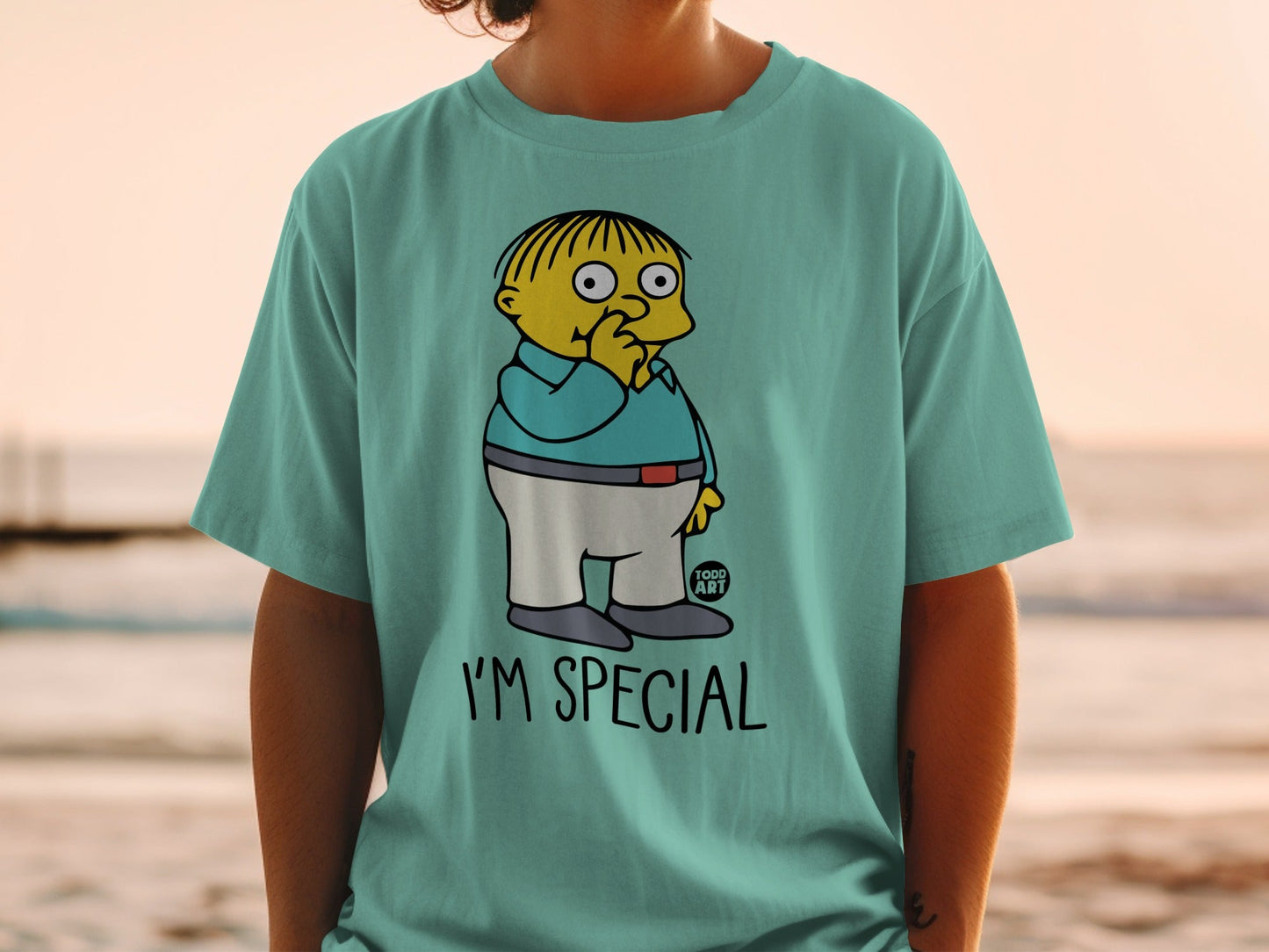 Ralph Wiggum on a teal t-shirt saying "I'M SPECIAL".