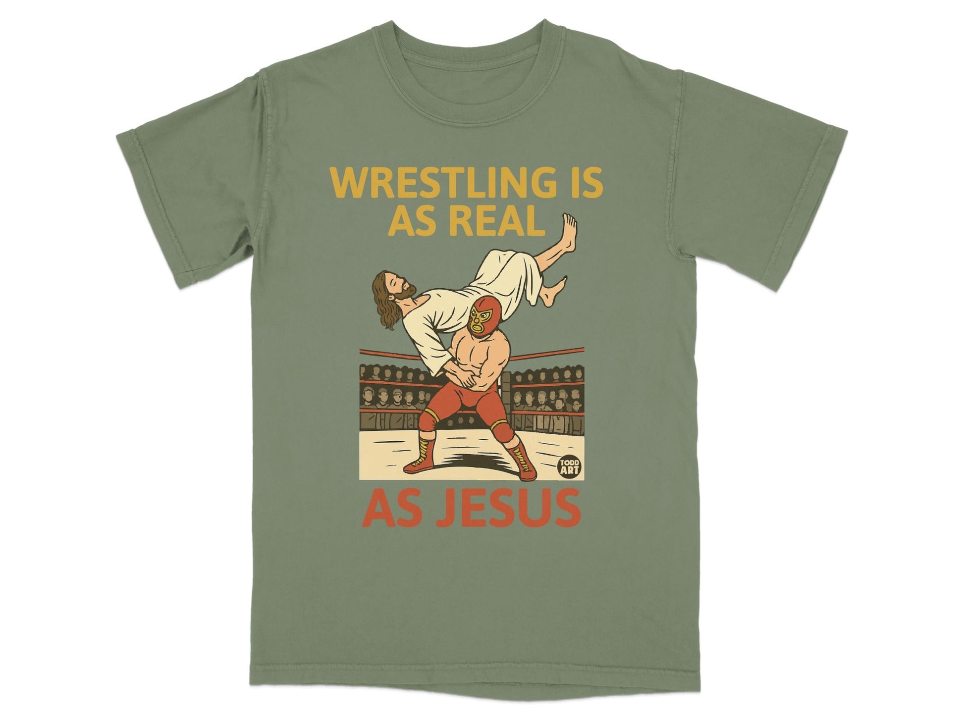 T-shirt graphic: Jesus wrestling in a ring, text "WRESTLING IS AS REAL AS JESUS".
