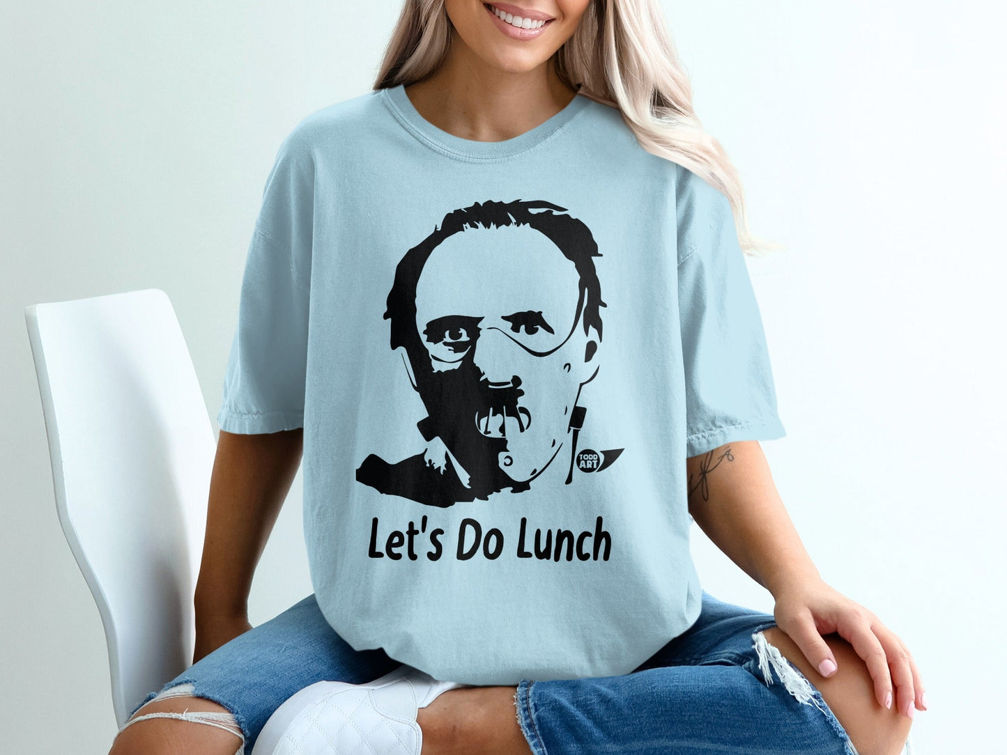 Light blue t-shirt with Hannibal Lecter graphic and "Let's Do Lunch" text.
