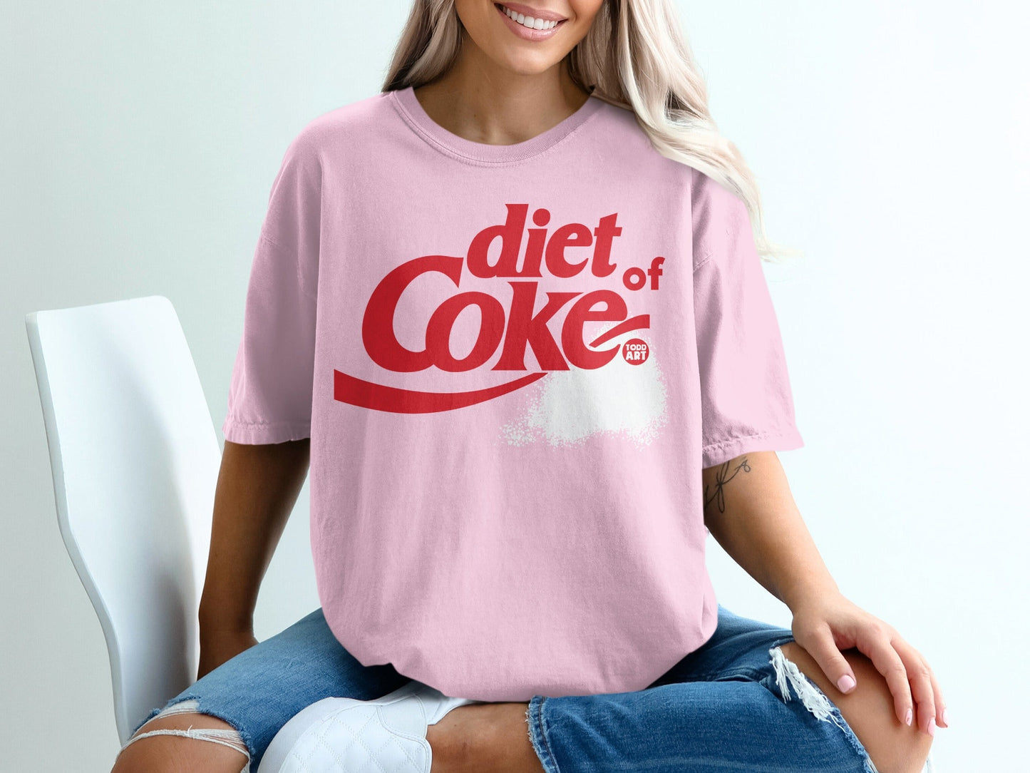 Pink t-shirt with "diet Coke" logo and a splatter design.