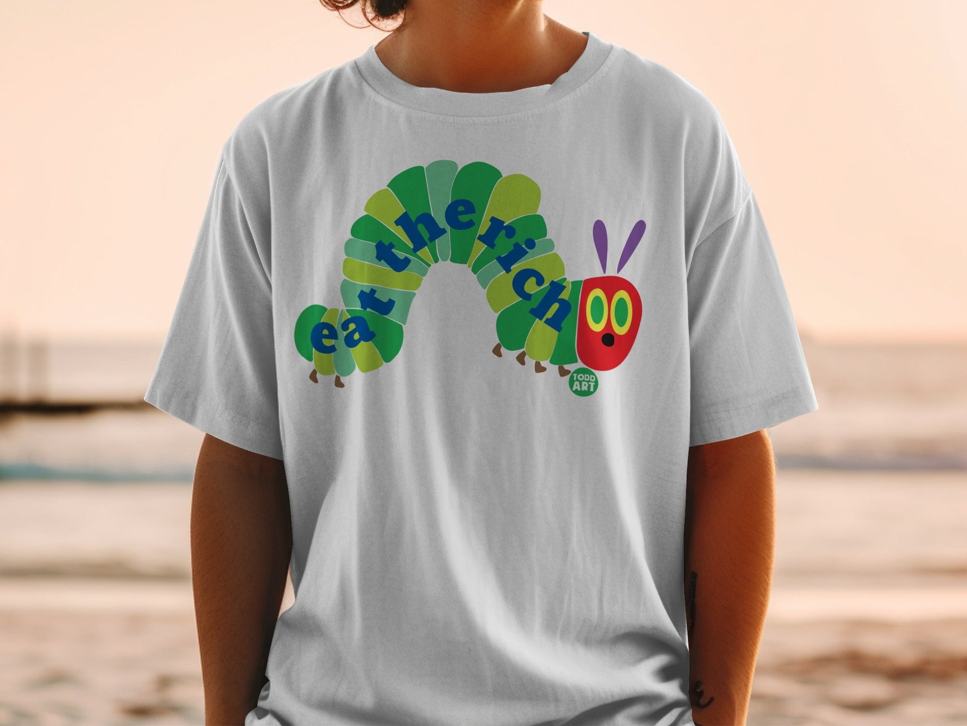 The Very Hungry Caterpillar graphic on a white t-shirt.