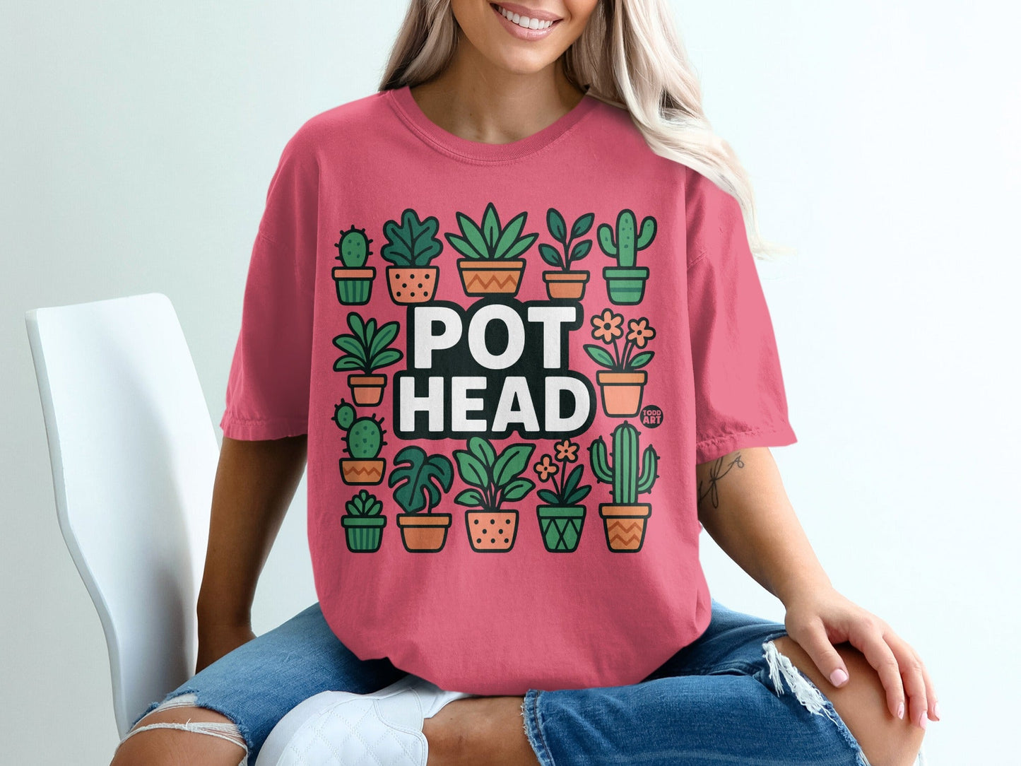 Pink t-shirt with colorful potted plants and "POT HEAD" text.