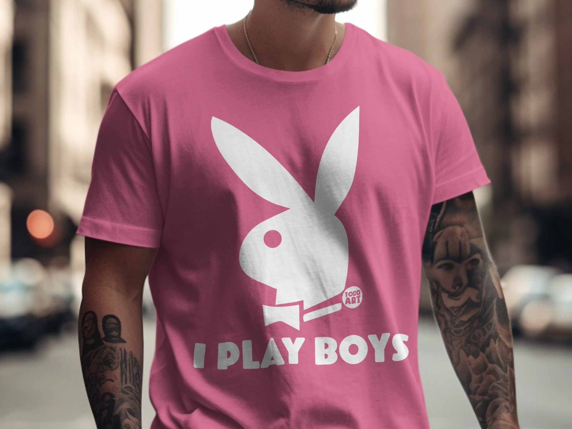 Pink t-shirt with white Playboy bunny logo and "I PLAY BOYS" text.