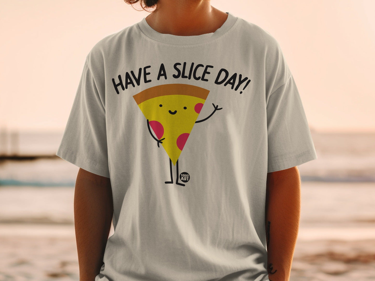 T-shirt with cartoon pizza slice saying "Have a slice day!"