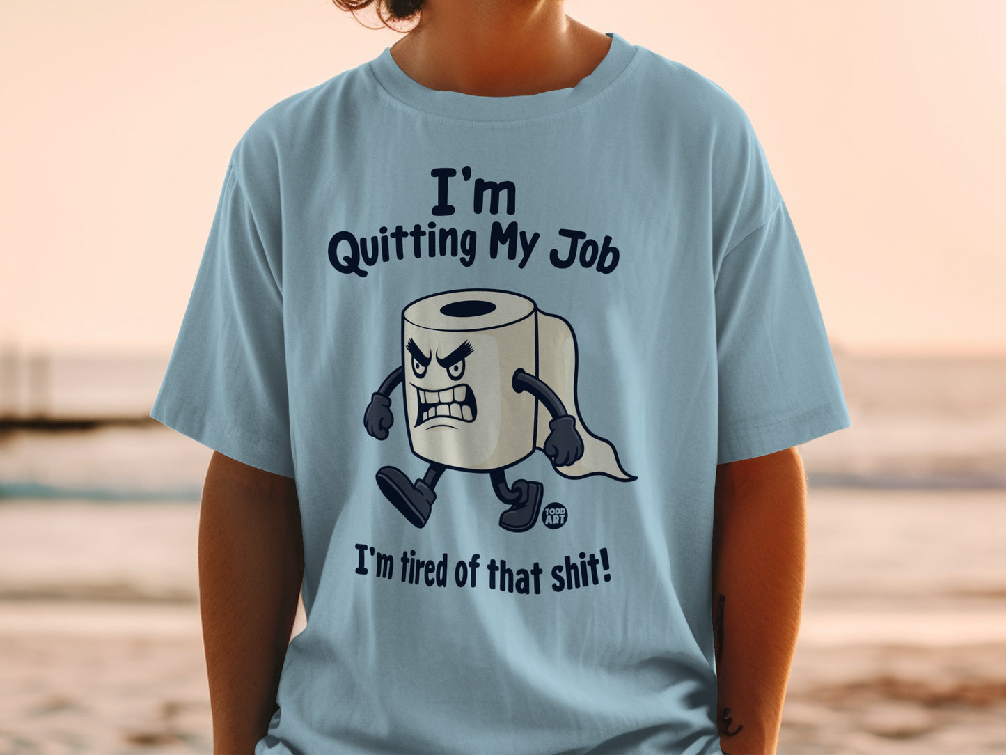 Light blue t-shirt with a cartoon roll of toilet paper stating "I'm Quitting My Job. I'm tired of that shit!".