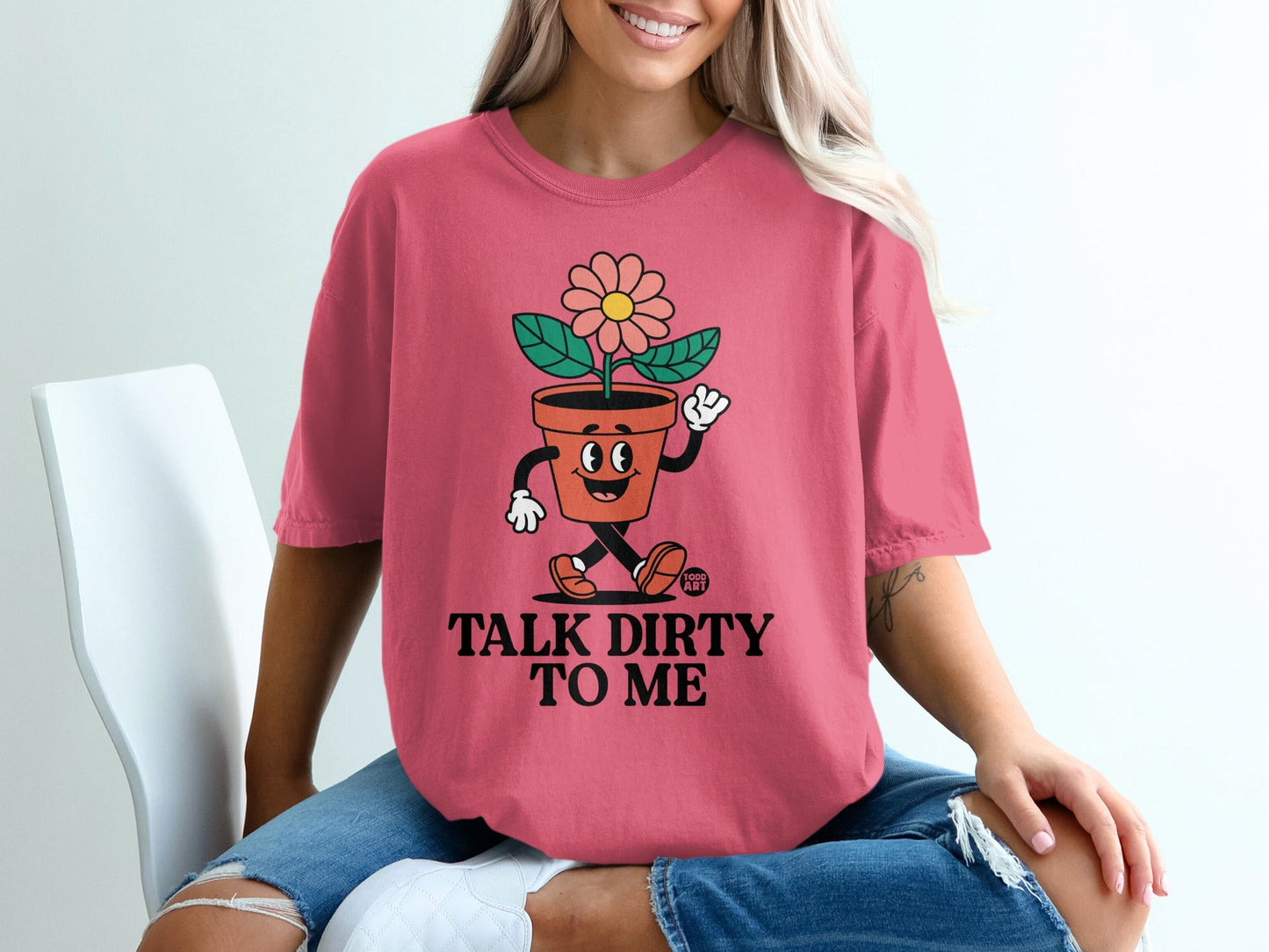 Pink t-shirt with cartoon flower pot saying "Talk Dirty To Me".