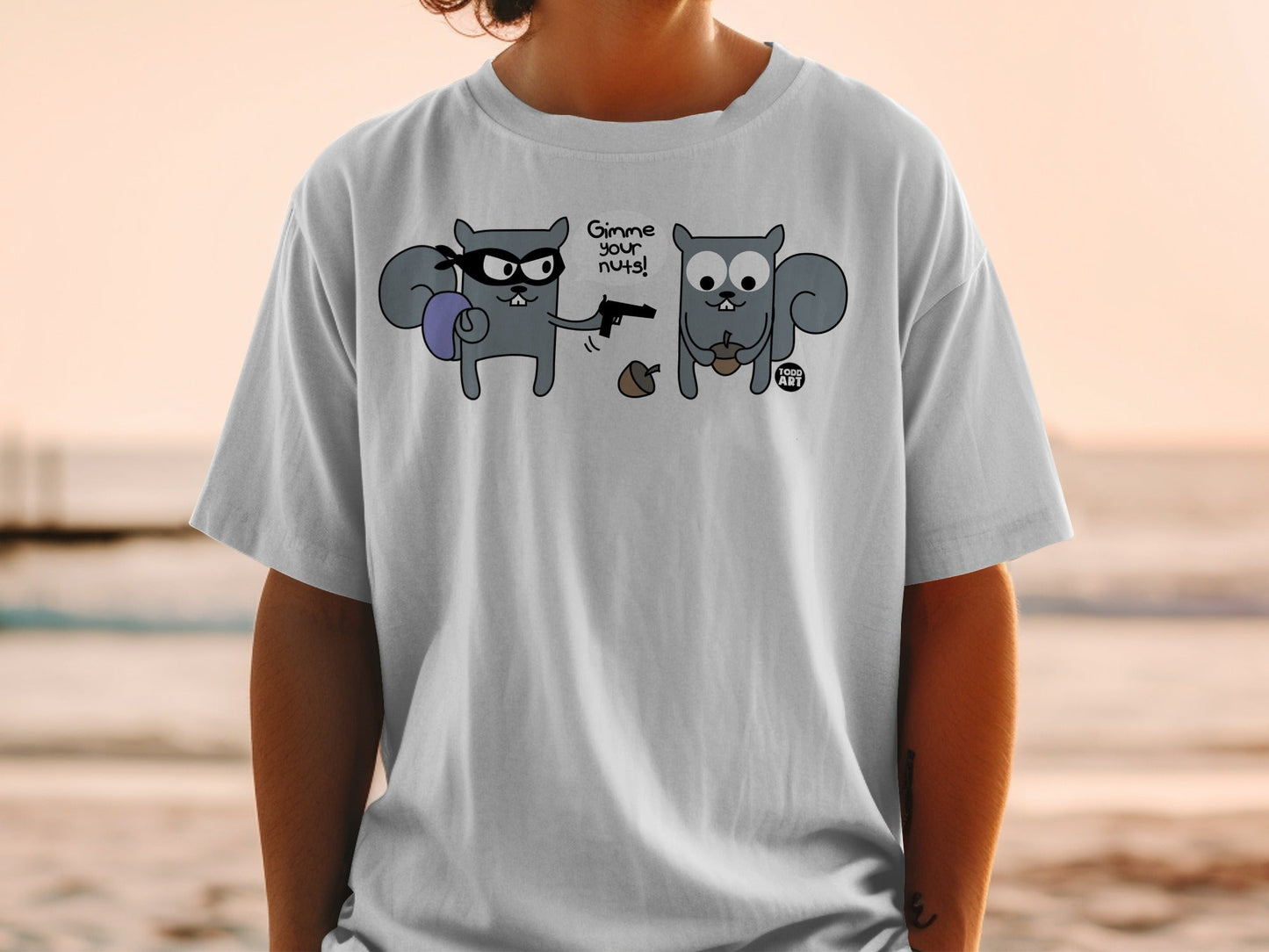 T-shirt with two cartoon squirrels, one robbing the other, with text "Gimme your nuts!".